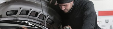 man working on a car